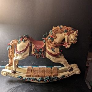 Vintage Christmas themed rocking horse with music box.